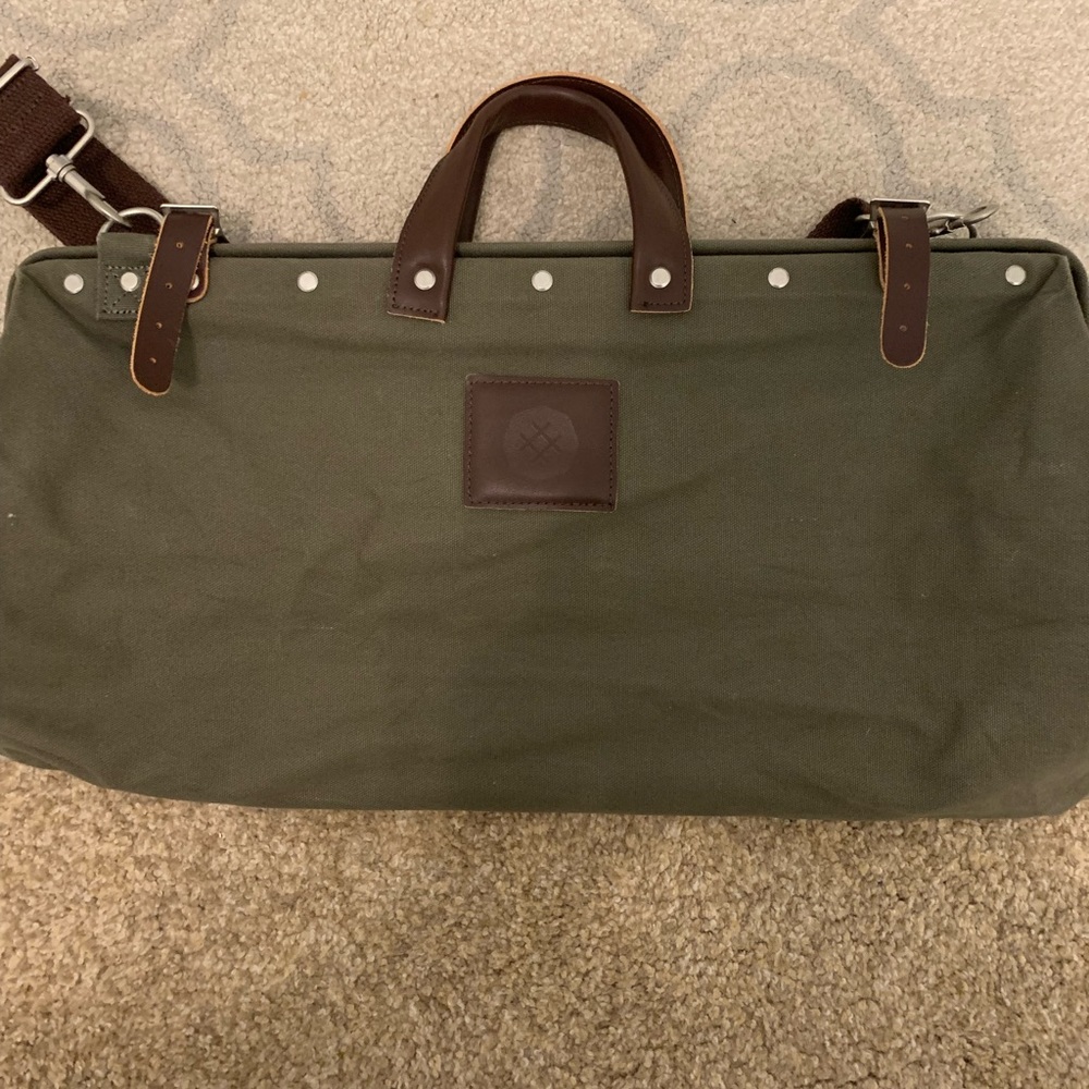 Olive green canvas travel duffel bag